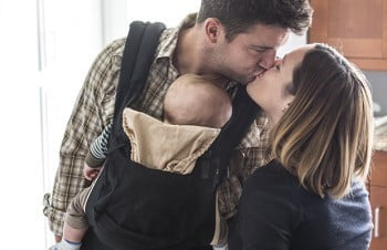 Mom and Dad Kissing With Baby