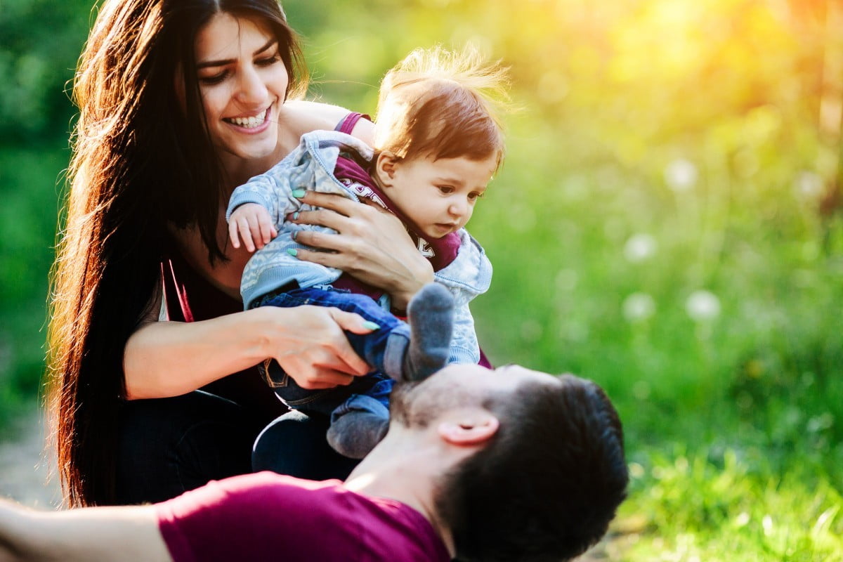 young family have fun and relaxing outdoors in the countryside